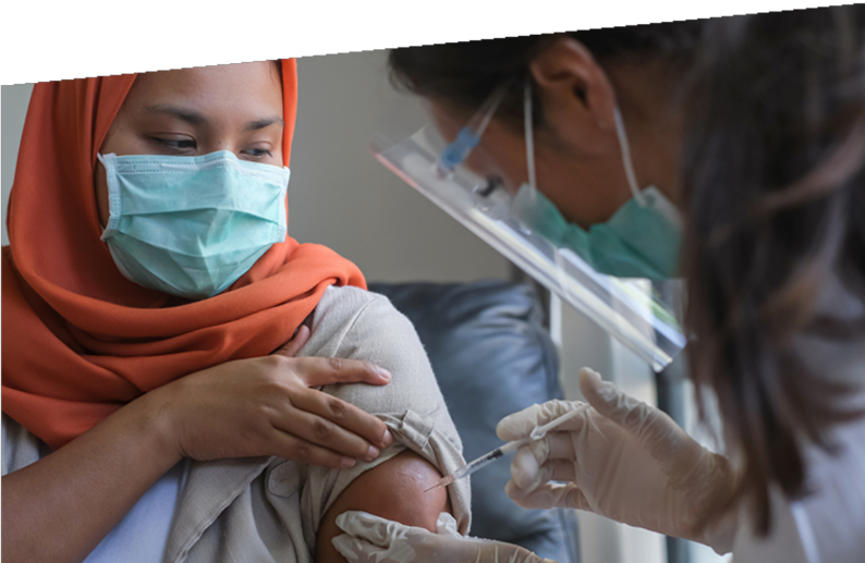 Photograph of a woman getting her flu jab.